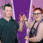 Two young people in front of a purple background