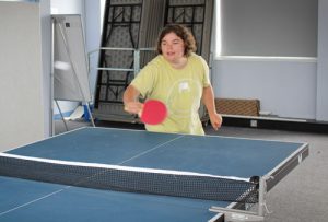 young woman playing table tennis