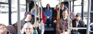 young people with learning disabilities on bus with their carers