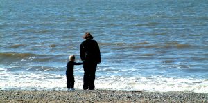 mum and child looking out to sea