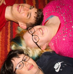laughing young people lying on floor