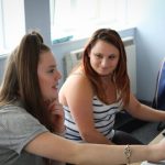 young women talking together