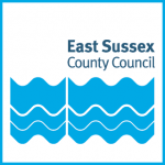 Logo reading "East Sussex County Council" with blue wavy lines