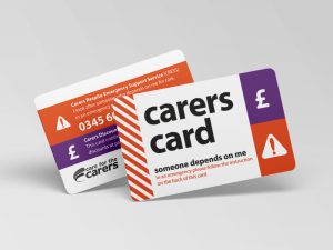 white credit card-sized card with the words 'carers card' in large black print, and graphics in purple and orange