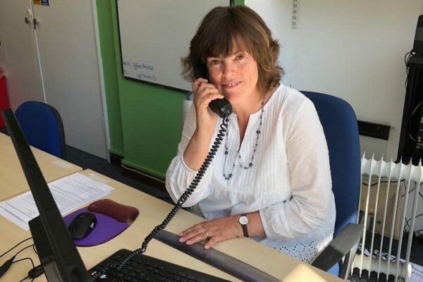 Amaze SENDIASS adviser, Sally, on the phone in our office.