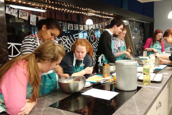 Young people in a cookery training session